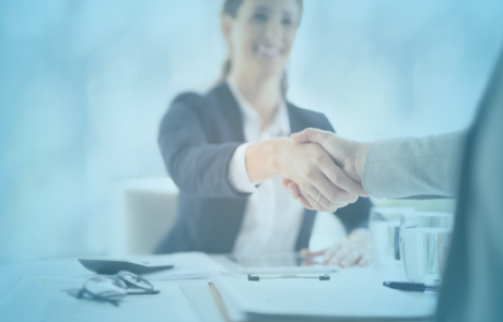A business woman shaking an unknown persons hand